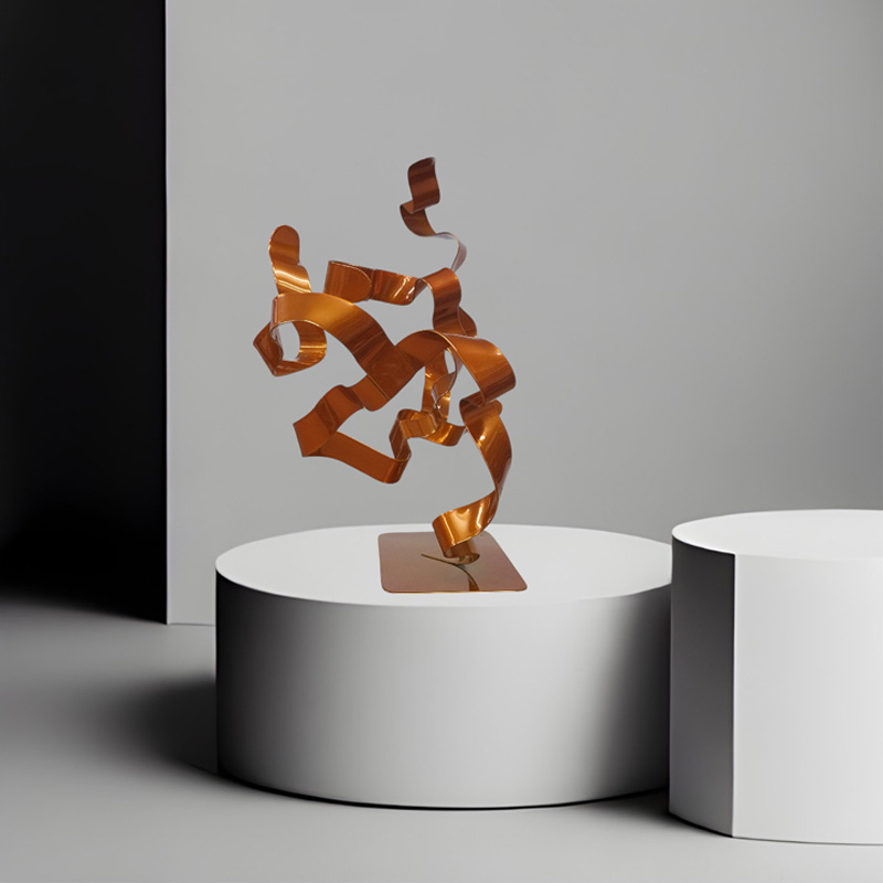 sculpture abstraite arbre ruban acier peint orange vue de profil